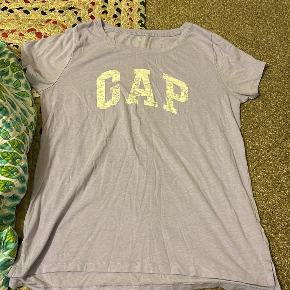 Light purple GAP shirt with rigged writing.(not faded I promise)